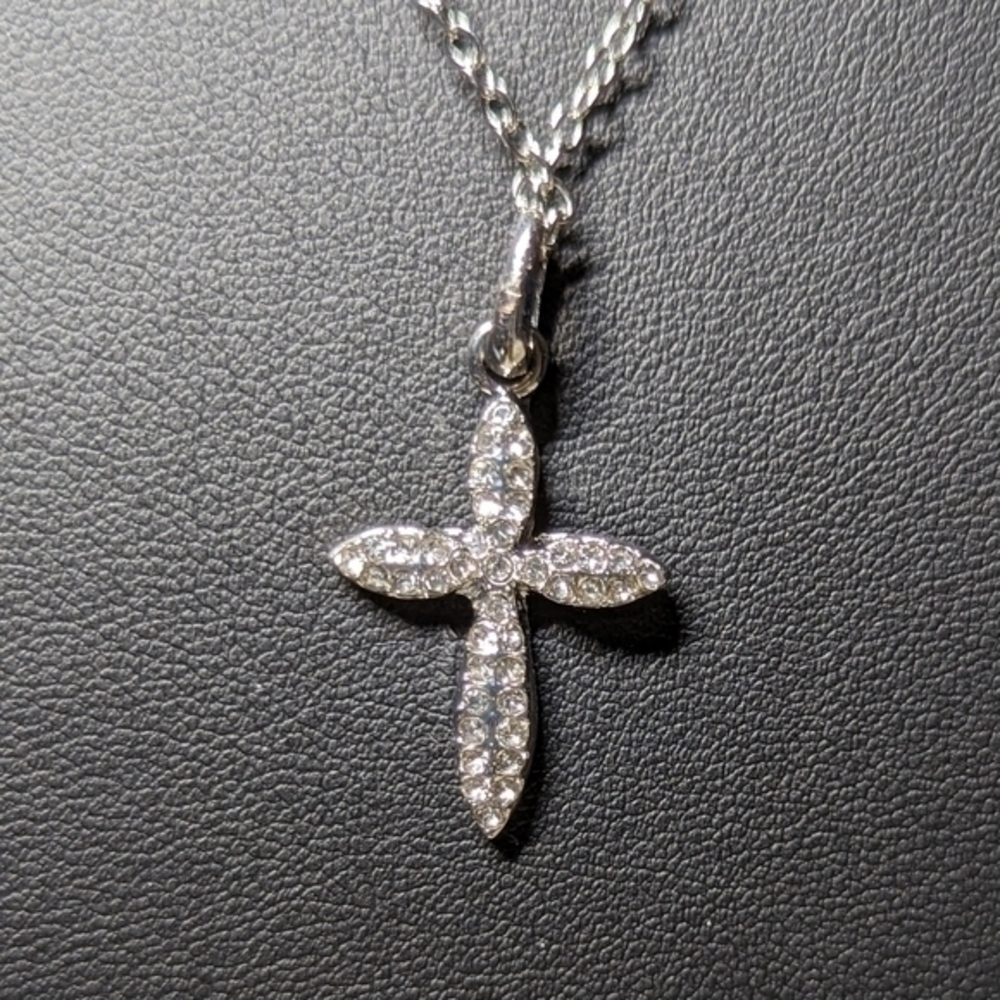 Pure expression hypoallergenic necklace with crystal pendant cross.